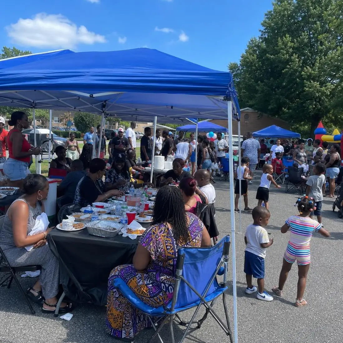 Community gathering under canopies